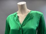 a close up of a green shirt on a mannequin mannequin