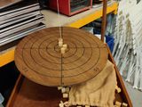 a wooden object that is sitting on top of a tray