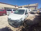 the white van is parked in a lot with other cars