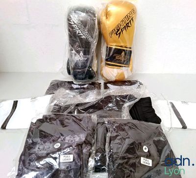 a bag of boxing gloves and a pair of gloves on a table