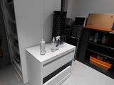 a picture of a white dresser in a room