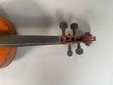 an image of a close up of a violin on a white surface