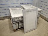 a stack of mattresses sitting on a pallet in front of a wall