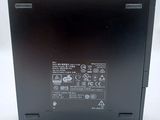 the back of a black laptop computer with a white background