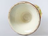 a close up of a cup on a white surface
