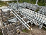 a lot of metal pipes and poles on the ground