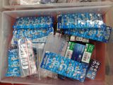 a plastic container filled with lots of items on a table