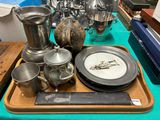 a tray with a tray of silverware on a table