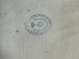 a stamp on the side of a building with a clock on it