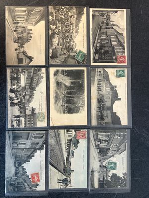 a lot of old postcards that are on the table
