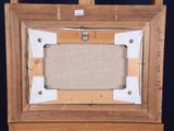 a picture of a picture frame on a wooden easel