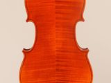 an old violin with a wooden back and bow on a white background