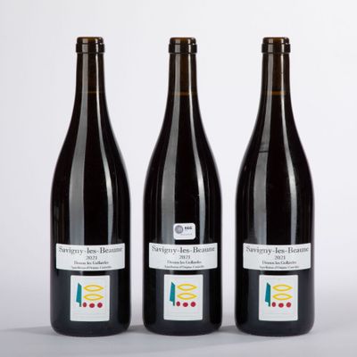 three bottles of wine sitting next to each other on a table