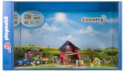 une boîte de Playmobil contenant une scène de ferme