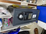 a safe box sitting on a shelf in a room