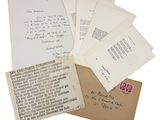 a pile of old letters and envelopes sitting on top of each other