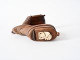 a brown glove that has a picture of a man on it