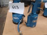 two electric drillers on a table with price tags on them