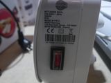 a close up of a small white device on a table