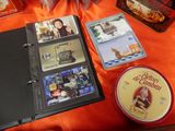 many items that are sitting on a table with orange cloth