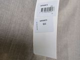 an image of a label on a dress hanging on a hanger