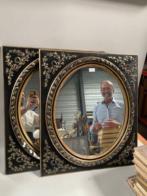 a man that is taking a picture of himself in the mirror