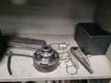 many tools that are sitting on a shelf in a room