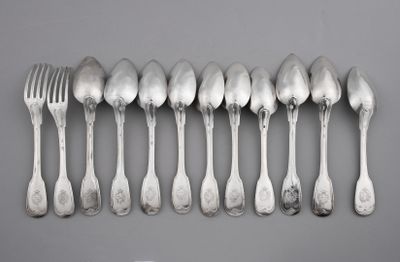 six spoons and six forks arranged in a row on a gray surface