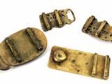 several pieces of brass are shown on a white surface