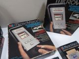 three boxed nintendo microvision games are on display on a table