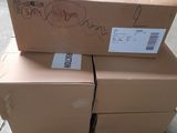 boxes stacked on top of each other on a pallet in a warehouse