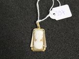 a necklace with a picture of a woman on it
