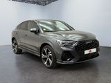 a grey audi qx parked in a showroom