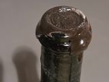a close up of a bottle of wine on a table