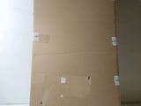 a cardboard box sitting on top of a white table