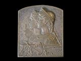 an image of a bronze plaque depicting a woman and a man