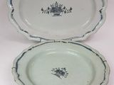 pair of blue and white porcelain dishes with floral designs