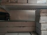 many boxes stacked on top of each other in a warehouse