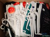 many pairs of scissors in a box of clothes
