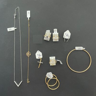 many different types of jewelry on display on the table