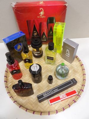 many different types of perfumes sitting on a tray