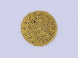 l'image d'une pièce d'or ornée d'une couronne