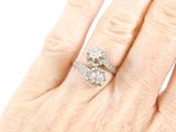 an image of a woman ' s hand with a diamond ring on it