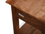 a small wooden table with a drawer underneath it