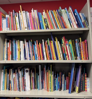 a bookshelf full of books in a library