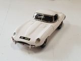 a toy car that is sitting on a white surface
