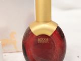 an image of a bottle of perfume sitting next to a box