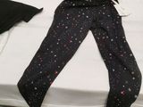 a pair of leggings that are on a bed