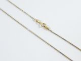 a pair of gold chains on a white background