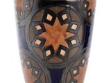 a blue vase with a design on it on a white background